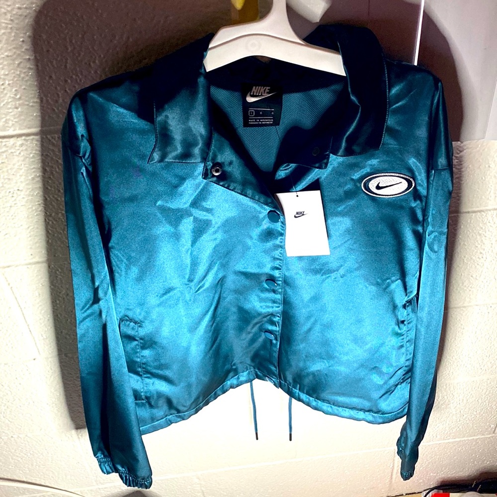 Blue Nike Bomber jacket.